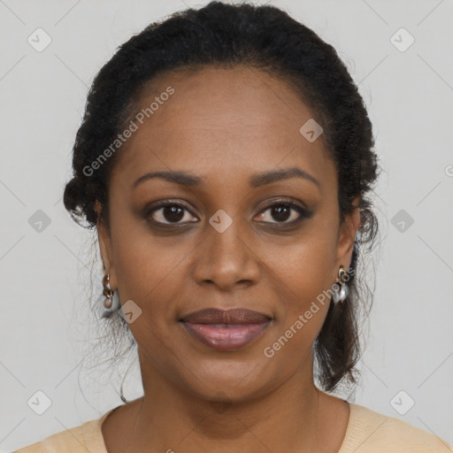 Joyful black young-adult female with long  brown hair and brown eyes