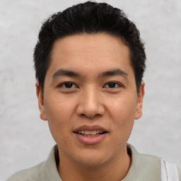 Joyful asian young-adult male with short  brown hair and brown eyes