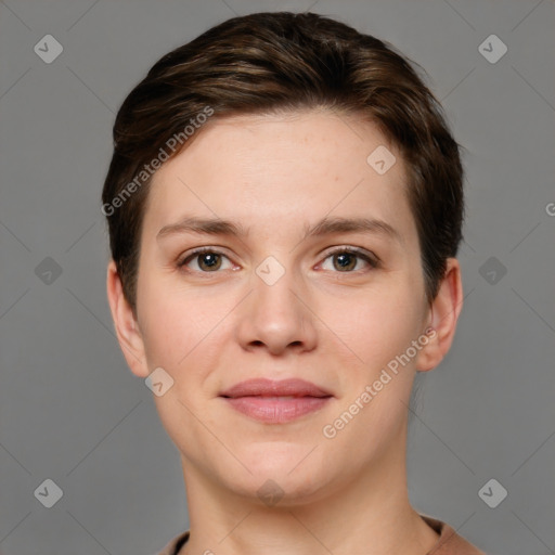 Joyful white young-adult female with short  brown hair and grey eyes