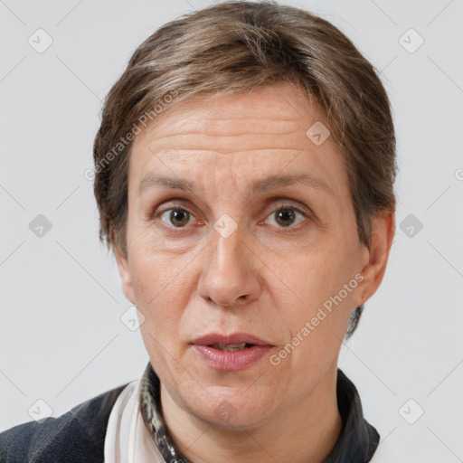 Joyful white adult female with short  brown hair and brown eyes