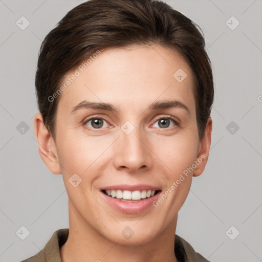 Joyful white young-adult female with short  brown hair and grey eyes