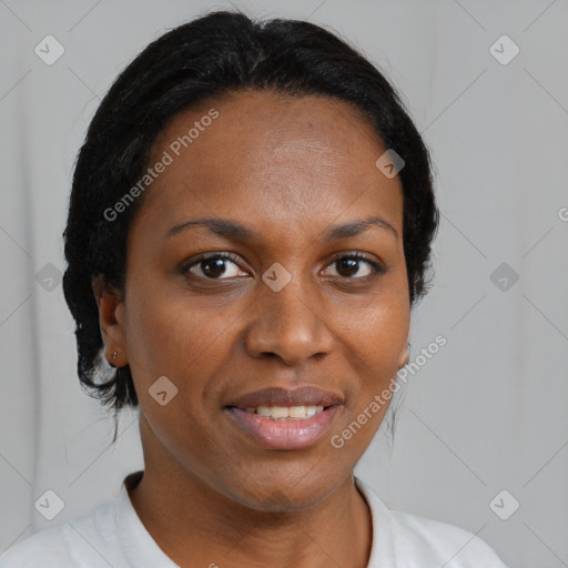 Joyful black adult female with medium  brown hair and brown eyes