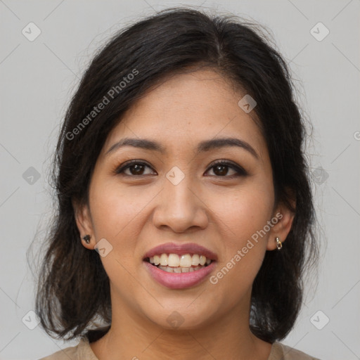 Joyful latino young-adult female with medium  brown hair and brown eyes