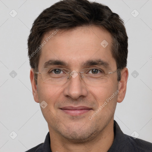 Joyful white adult male with short  brown hair and brown eyes