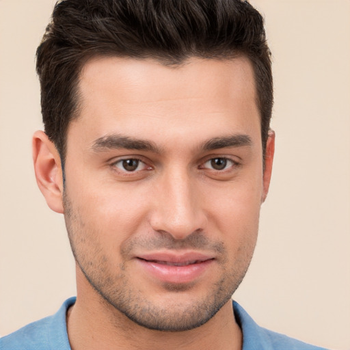 Joyful white young-adult male with short  brown hair and brown eyes