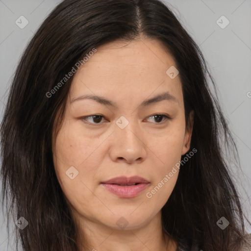 Joyful asian young-adult female with long  brown hair and brown eyes