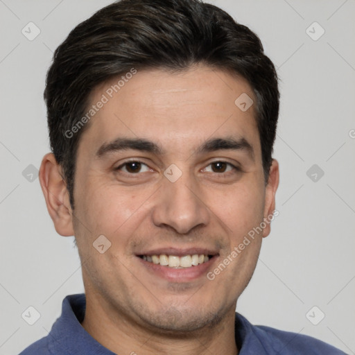 Joyful white young-adult male with short  black hair and brown eyes