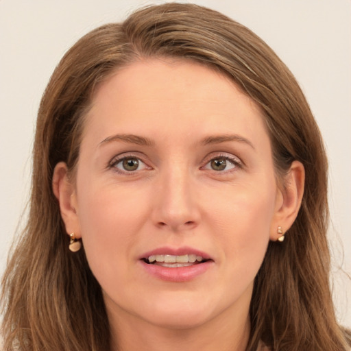 Joyful white young-adult female with long  brown hair and grey eyes