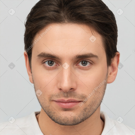 Neutral white young-adult male with short  brown hair and brown eyes