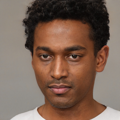 Neutral black young-adult male with short  black hair and brown eyes