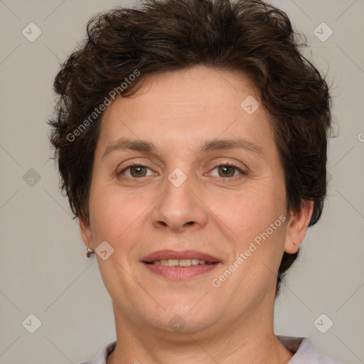 Joyful white adult female with short  brown hair and brown eyes