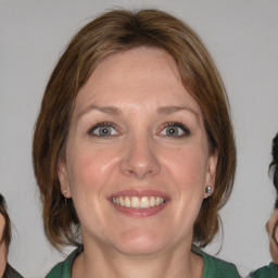 Joyful white young-adult female with medium  brown hair and blue eyes