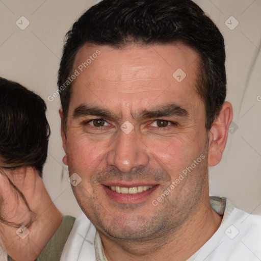 Joyful white adult male with short  brown hair and brown eyes