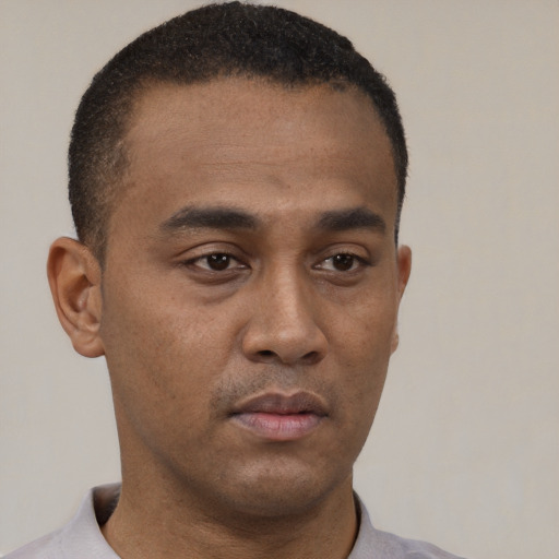 Neutral black young-adult male with short  brown hair and brown eyes