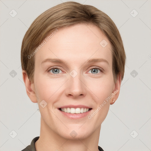 Joyful white young-adult female with short  brown hair and grey eyes