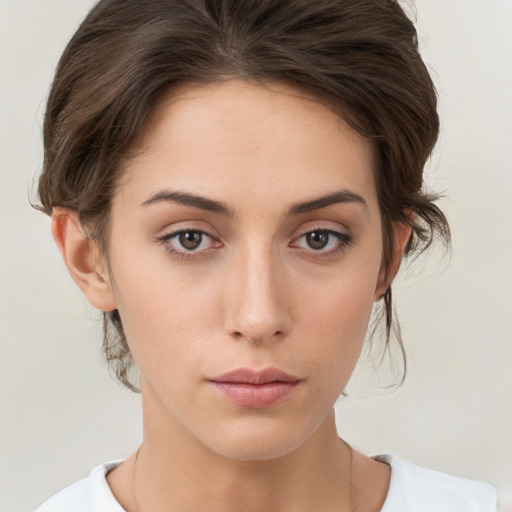 Neutral white young-adult female with medium  brown hair and brown eyes