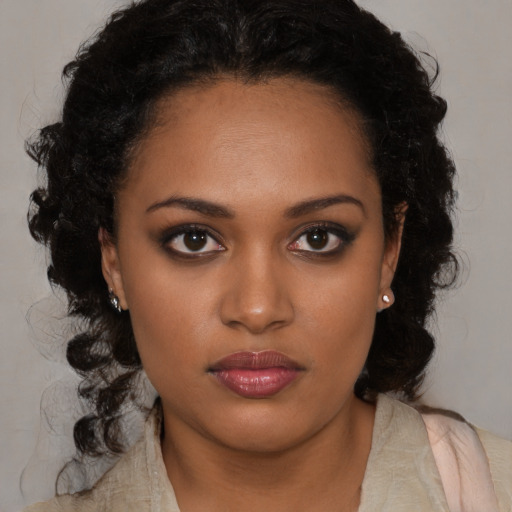 Neutral black young-adult female with long  brown hair and brown eyes