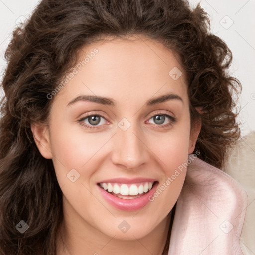 Joyful white young-adult female with long  brown hair and green eyes