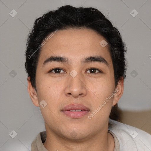 Joyful latino young-adult male with short  brown hair and brown eyes