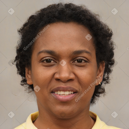 Joyful black adult female with short  brown hair and brown eyes