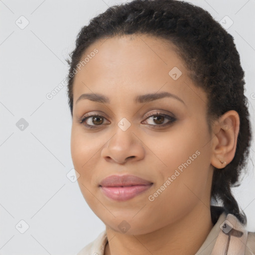 Joyful latino young-adult female with long  brown hair and brown eyes