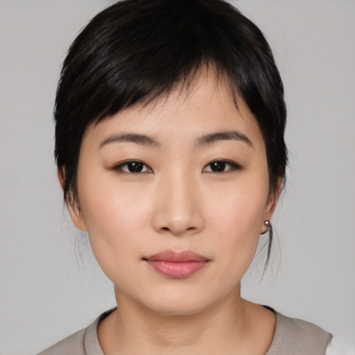 Neutral asian young-adult female with medium  black hair and brown eyes