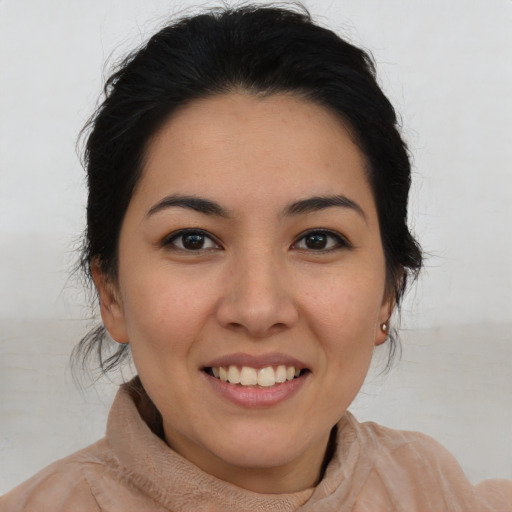 Joyful asian young-adult female with medium  brown hair and brown eyes
