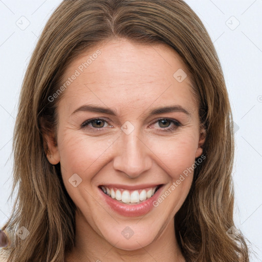 Joyful white young-adult female with long  brown hair and brown eyes