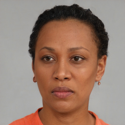 Neutral black adult female with short  black hair and brown eyes
