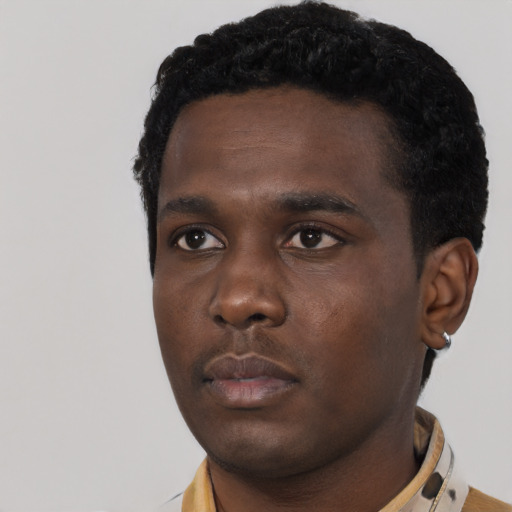 Neutral black young-adult male with short  black hair and brown eyes