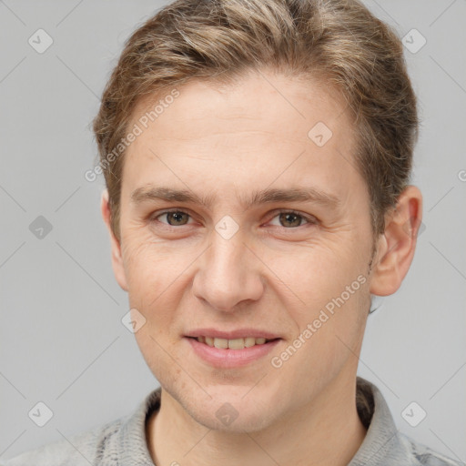 Joyful white adult male with short  brown hair and grey eyes