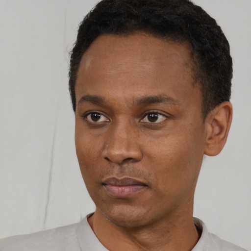 Neutral black young-adult male with short  black hair and brown eyes