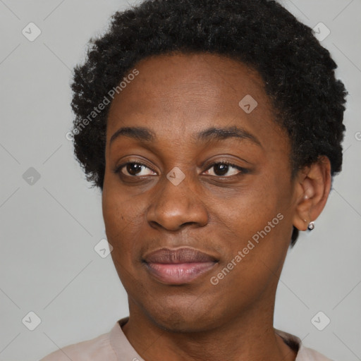 Joyful black adult female with short  brown hair and brown eyes