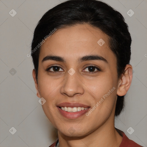 Joyful latino young-adult female with medium  brown hair and brown eyes