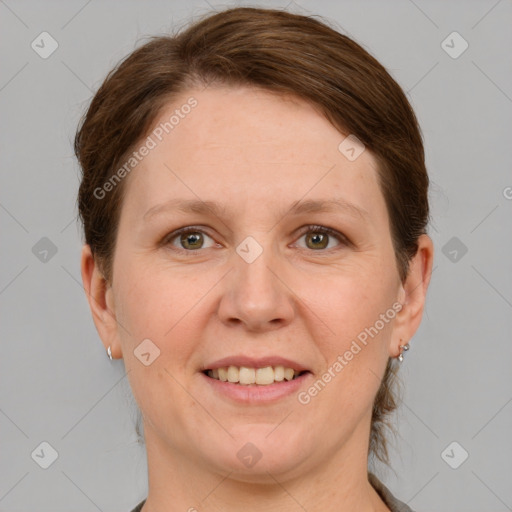 Joyful white adult female with short  brown hair and grey eyes