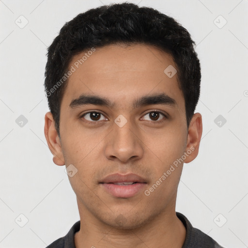 Neutral latino young-adult male with short  black hair and brown eyes