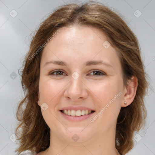 Joyful white young-adult female with medium  brown hair and green eyes