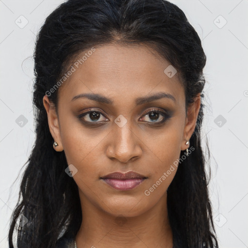 Joyful black young-adult female with long  brown hair and brown eyes