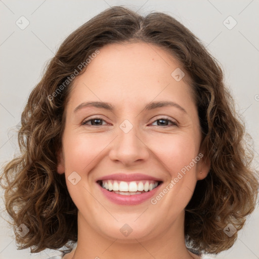 Joyful white young-adult female with medium  brown hair and green eyes