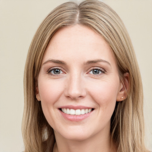 Joyful white young-adult female with long  brown hair and grey eyes