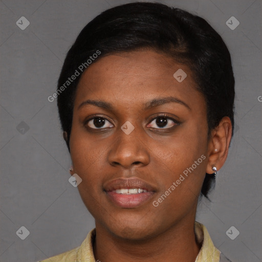 Joyful black young-adult female with short  black hair and brown eyes