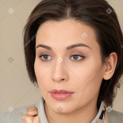 Neutral white young-adult female with long  brown hair and brown eyes