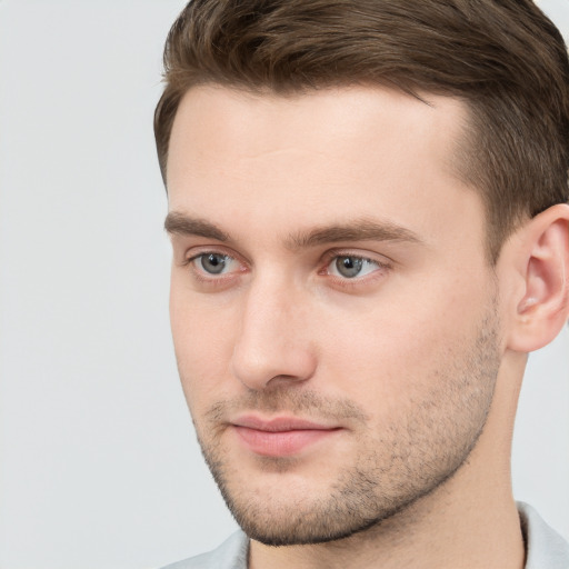 Neutral white young-adult male with short  brown hair and grey eyes