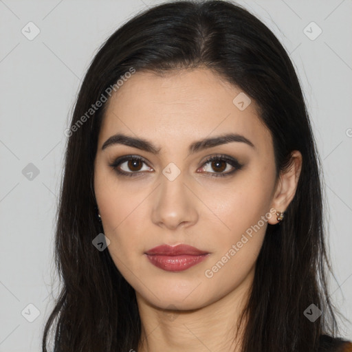 Joyful latino young-adult female with long  brown hair and brown eyes