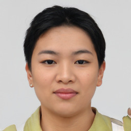 Joyful asian young-adult female with short  black hair and brown eyes