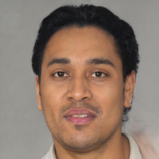 Neutral latino young-adult male with short  black hair and brown eyes