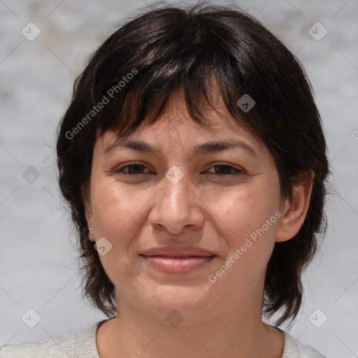 Joyful white adult female with medium  brown hair and brown eyes