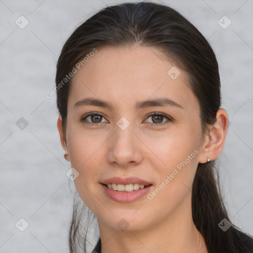 Joyful white young-adult female with long  brown hair and grey eyes