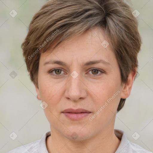 Joyful white adult female with short  brown hair and grey eyes