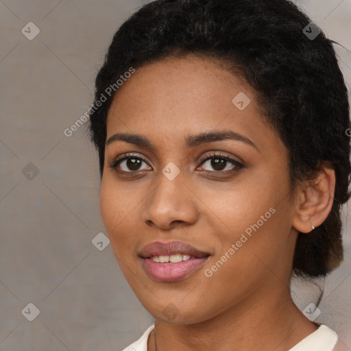 Joyful black young-adult female with medium  brown hair and brown eyes